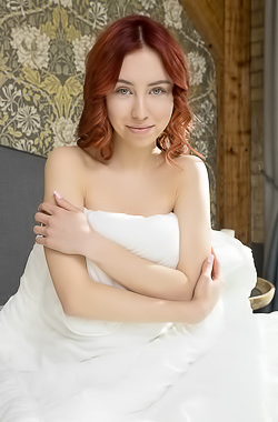 Rosalind Parts Her Slender Thighs To Frame Her Shaved Pussy